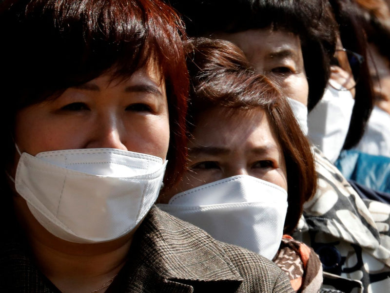 Koreans wearing face masks during the COVID-19 corona pandemic (Source: wsj.com)